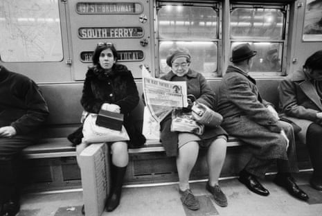 An older white woman reads the Black Panther newspaper on the New York subway in 1970.