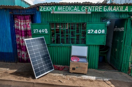 A solar panel outside a clinic made of corrugated iron in rural Kenya.