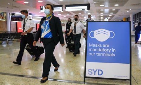 A flight crew walk through the terminal at Sydney Airport