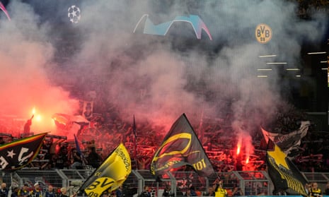 Supporters cheer before the Champions League semi-final first leg between Borussia Dortmund and Paris Saint-Germain at the Signal-Iduna Park stadium.