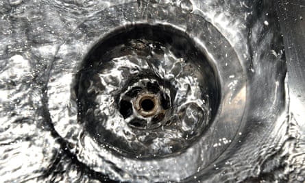 Water going down a plughole in a sink