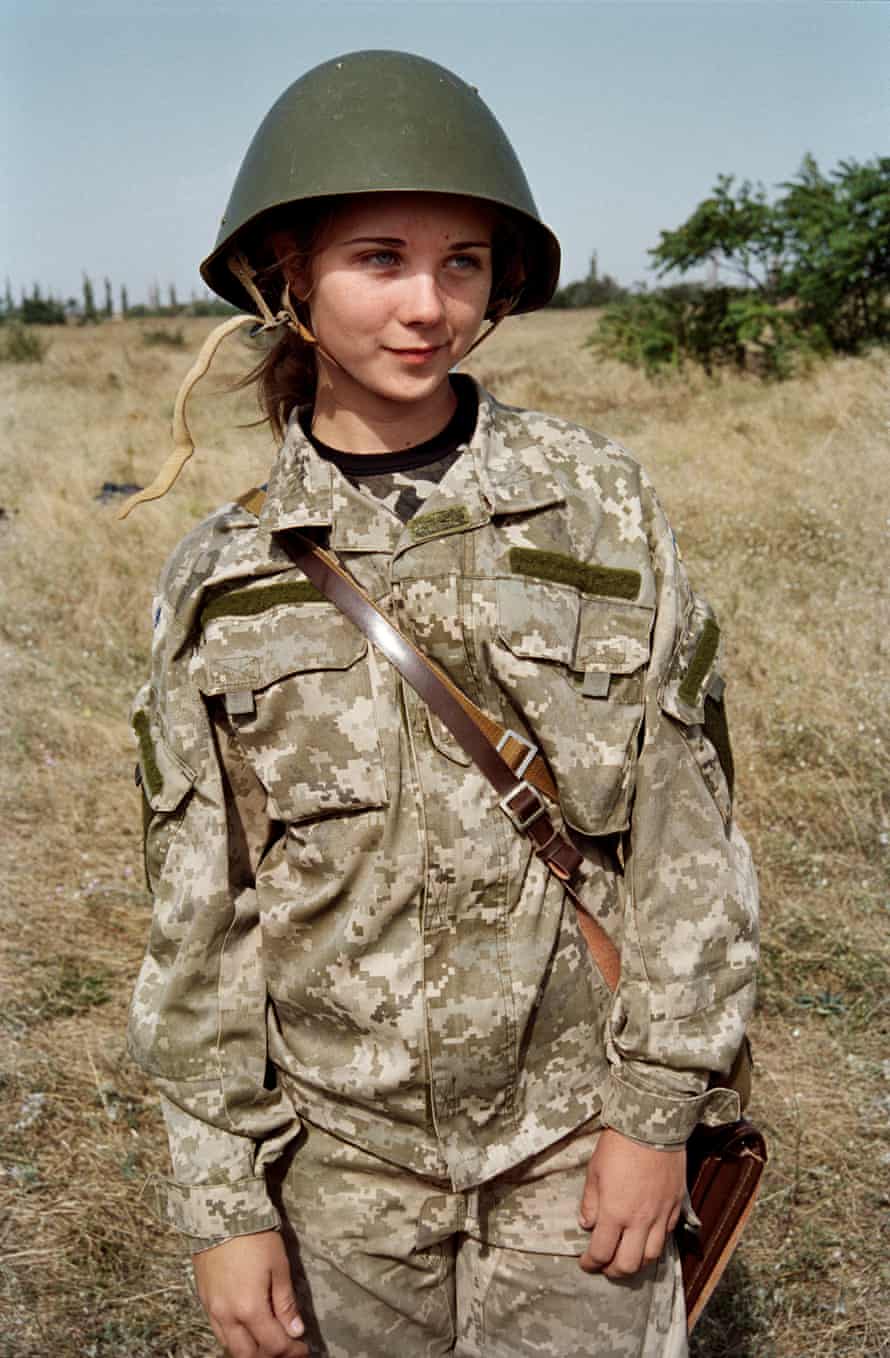 Loss of innocence… a young girl in uniform.