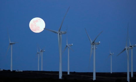 The super Full Worm Moon rises over a wind turbine farm in March