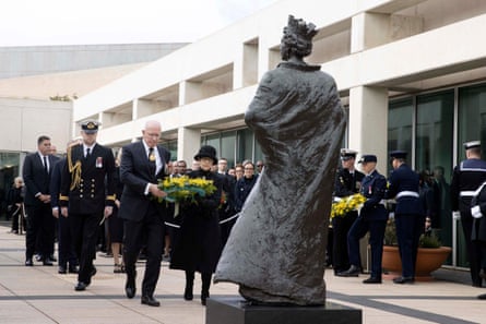Australia’s governor general David Hurley and his wife Linda Hurley lay a wreath at the statue of Queen Elizabeth II at Parliament House in Canberra