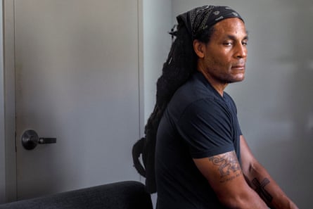 Michael Thomas sitting in a chair and looking pensive