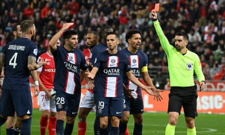 PSG’s Sergio Ramos argues with the referee, Pierre Gaillouste, after he shows him a red card during the Ligue 1 match against Reims.
