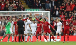 Virgil van Dijk appeals to referee Mike Dean for a corner.