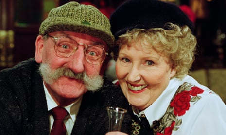 Paula Tilbrook as Betty Eagleton and Stan Richards as Seth Armstrong at the Valentine’s Day karaoke night at the Woolpack in Emmerdale, 2002.