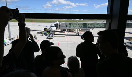 Visitors watch the first commercial flight from Western Sydney international airport, Jetstar flight JQ362 to the Gold Coast, leave.