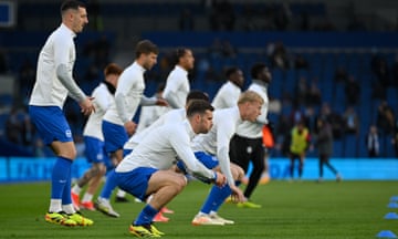 Brighton players warm up before kick-off