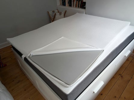 Ikea Nordberget mattress pad, showing grey foam with removable white cover.