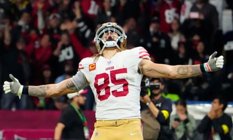 George Kittle celebrates his touchdown reception against the Arizona Cardinals
