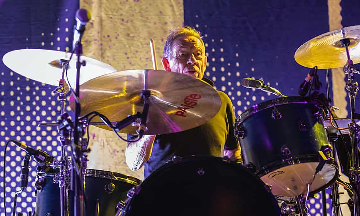 Cook playing drums