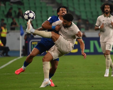 Esteghlal and Al-Sadd players collide during the AFC Champions League Elite match at the Basra Sports Complex in Basra, Iraq