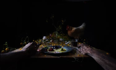 Abstract image of a person at a table with a plate of food