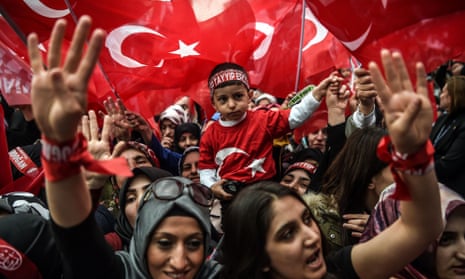 Supporters of Turkey’s president, Recep Tayyip Erdogan, wave and cheer at a rally in Istanbul.