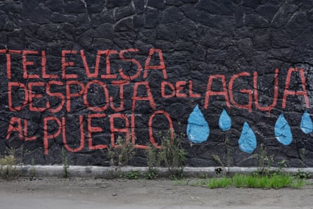 View of slogans in Spanish against the dispossession of land and water outside the Azteca Stadium
