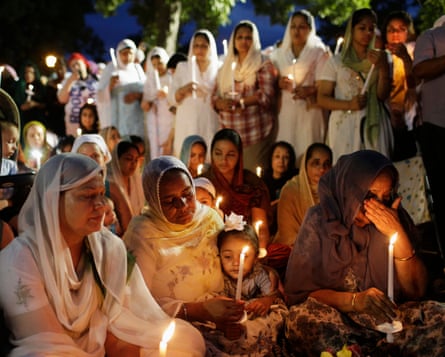 Sikhs attend a vigil in Wisconsin in 2012 after six worshipers were killed.