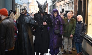 Participants in costume poses for a photograph at the  'Whitby Goth Weekend' festival