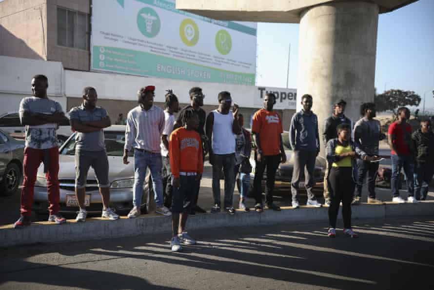 Migrants from Haiti and Africa wait to see if their number will be called to cross the border to apply for asylum in the US, in Tijuana.