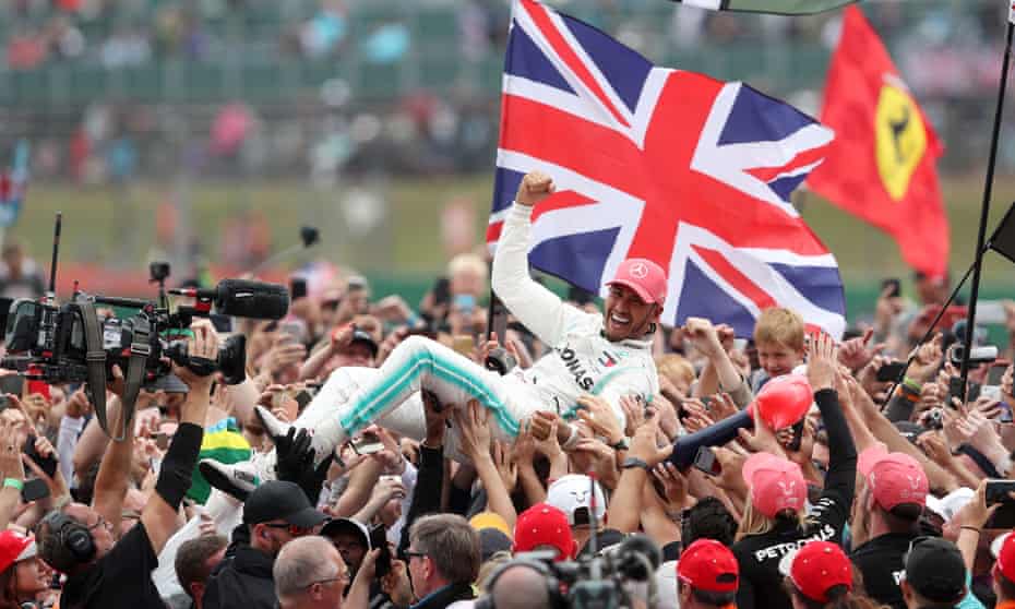 Lewis Hamilton is held aloft by the fans after his victory at Silverstone in 2019 – the last time the F1 British GP took place in front of spectators. 