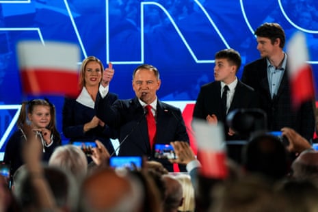 Karol Nawrocki, with his wife, Marta Nawrocka, his sons, Antoni and Daniel, and his daughter, Katarzyna, react to news of the exit poll.