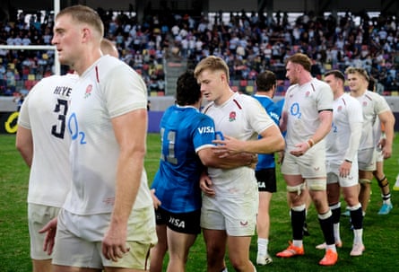 Fin Smith and England shake hands with Argentina players.