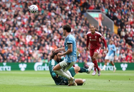 Neco Williams of Nottingham Forest is fouled by Liverpool keeper Alisson which resulted in a penalty.
