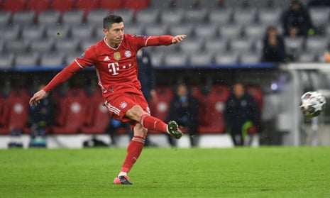 Bayern Munich’s Robert Lewandowski scores their first goal from the penalty spot.