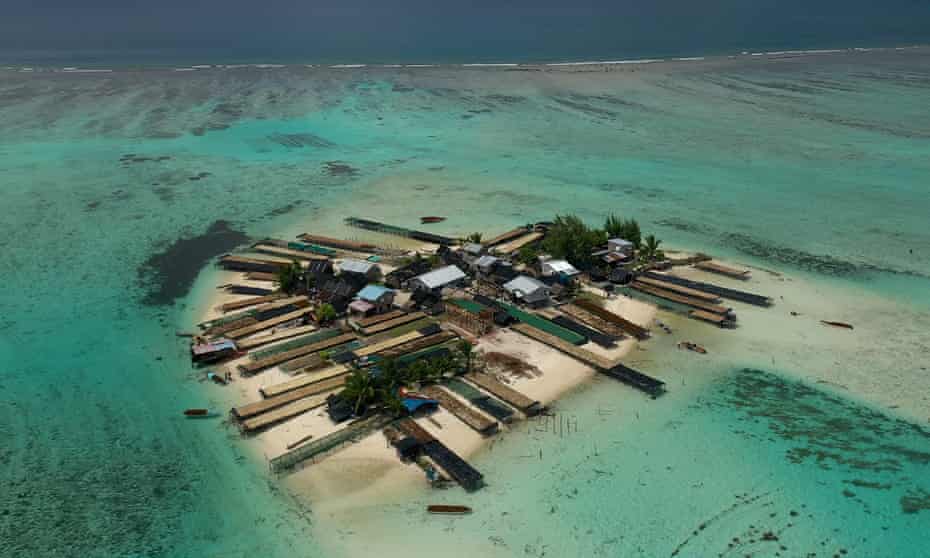 Harvested seaweed dries on jetties on an islet off Wagina