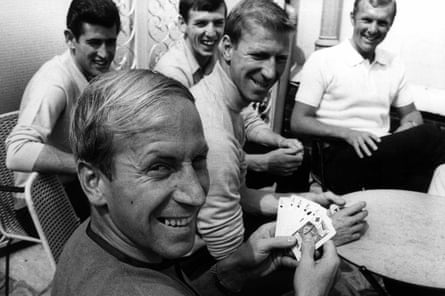 Bobby Charlton enjoys a lighter moment with Jack, holding a full house in a game of cards with Peter Bonetti, Martin Peters, his brother and Bobby Moore in 1966