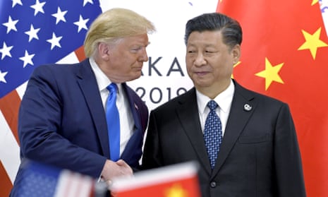 Donald Trump, left, shakes hands with Xi Jinping during a meeting on the sidelines of the G20 summit in Osaka, Japan, in 2019.