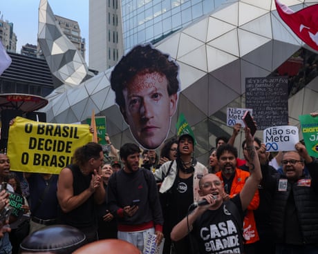 Protesters outside Meta’s headquarters in São Paulo holding up a cardboard cutout of chief executive Mark Zuckerberg.