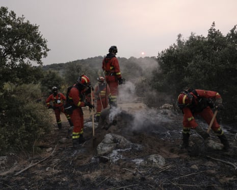 Firefighters battle a wildfire in Zarzalejo area, near El Escorial, 60 kms northwest of Madrid.