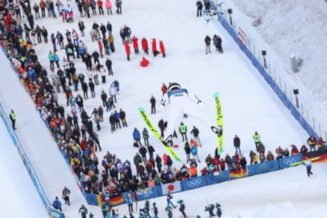 Austria's Johannes Lamparter flying high above spectators.