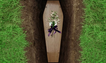 Coffin in open grave