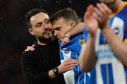 Brighton’s Roberto De Zerbi consoles Solly March after he was the only player to miss in the penalty shootout