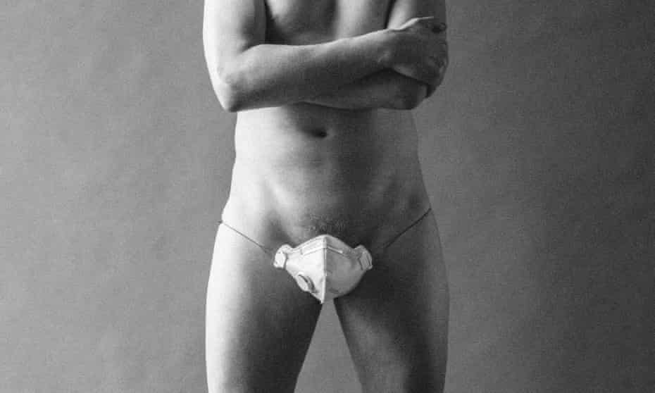 A male model wearing a face mask over his genitals