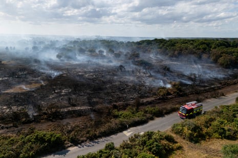An aerial view taken with a drone shows smoke rising from wildfires near Dunwich Heath in Suffolk.