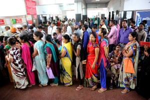 Patients queue for treatment following an outbreak of dengue fever in Bhopal, India this month.