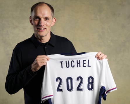 England head Thomas Tuchel poses for a photograph aft his caller deal