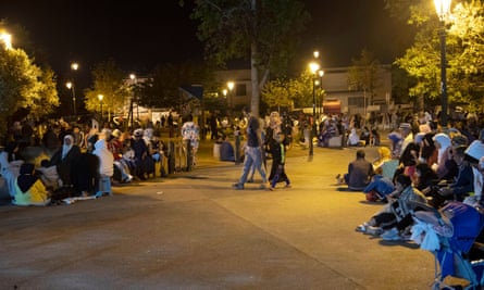 People in street at night
