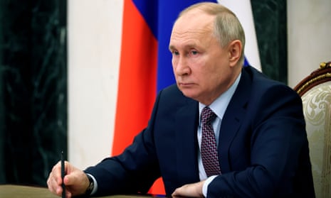 Vladimir Putin attends a meeting