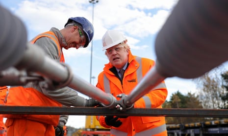 Boris Johnson helps fix a rail sleeper
