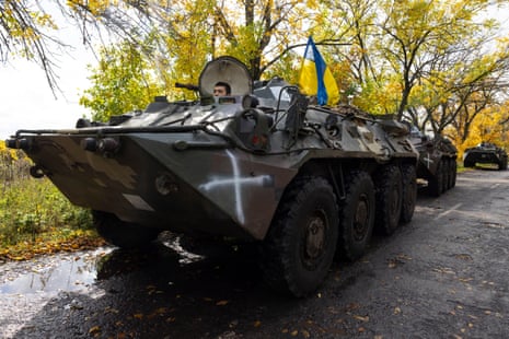 Armoured personnel carriers head to the front lines outside of Kramatorsk.