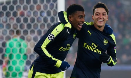 Alex Iwobi celebrates with Mesut Özil after scoring his first Champions League goal, in Arsenal’s win at Basel