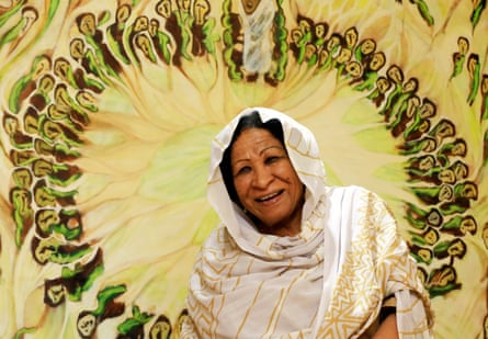 Pioneer … Kamala Ibrahim Ishag in front of painting Procession (Zaar).