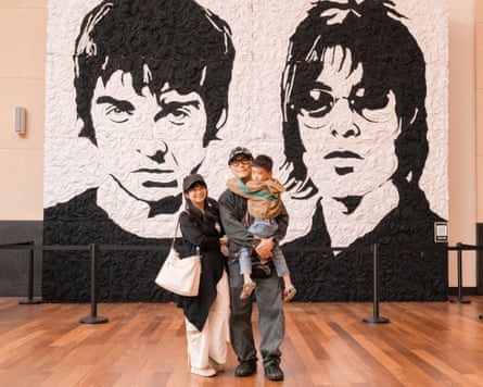 Yi Chieh, Po Chang and Kiwie, 5, in front of Oasis mural