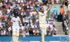 Chris Woakes of England successfully appeals for the wicket of Ajinkya Rahane