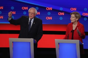 Senators Bernie Sanders and Elizabeth Warren speak during the Democratic debate in Detroit, Michigan.
